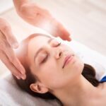 close-up-therapist-s-hand-performing-reiki-treatment-young-woman-spa-therapist-performing-reiki-healing-treatment-147796204 close-up-therapist-s-hand-performing-reiki-treatment-young-woman-spa-therapist-performing-reiki-healing-treatment-147796204