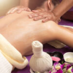 istockphoto-1166459611-612x612 Massage and body care. Young woman tan or honey skin receiving relaxing shoulder massaging in a spa house. Beautiful woman having massage in the spa salon for beauty care.