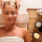 High angle portrait of an attractive female getting recreation massage of head High angle portrait of an attractive female getting recreation massage of head