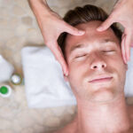 Happy man relaxing at the spa Happy man relaxing at the spa